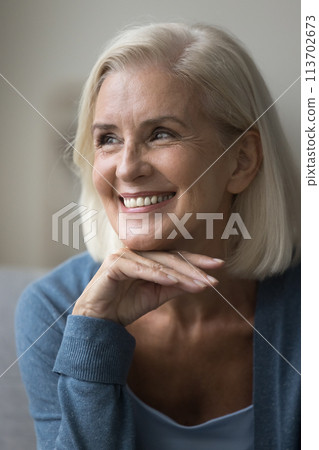 Vertical portrait of satisfied mature smiling woman 113702673