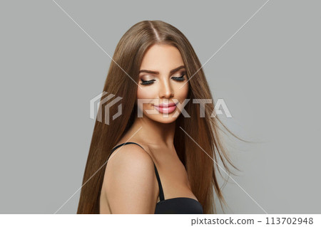 Beautiful fashion model woman with long healthy hairstyle, fresh shiny skin and makeup 113702948