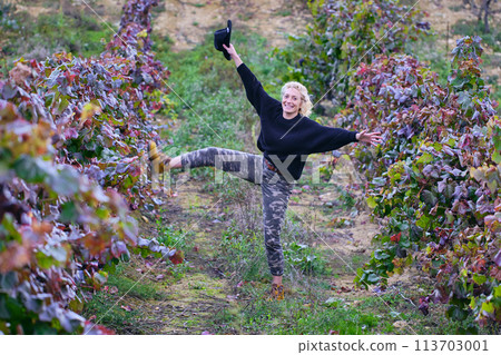 Joyful mature young blondy farmer woman in a vineyard farmland Joyful mature young blondy farmer woman in a vineyard farmland 113703001