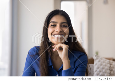 Happy young Indian woman front head shot Happy young Indian woman front head shot 113703132
