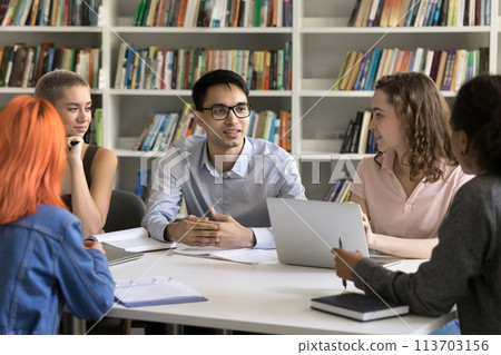 Diverse students share ideas engaged in teamwork in college library 113703156