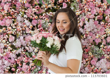 Romantic portrait of beautiful woman with pink flowers Romantic portrait of beautiful woman with pink flowers 113703601