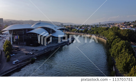 Amazing Roof of  Public Service Hall- House of Justice  and Tvtower on hill  and  car traffic on left side of Kura river 113703781