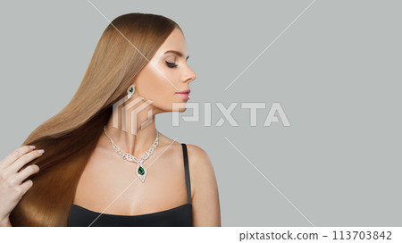 Stylish jewelry model beautiful woman portrait. Brunette woman with long smooth hair and necklace Stylish jewelry model beautiful woman portrait. Brunette woman with long smooth hair and necklace 113703842