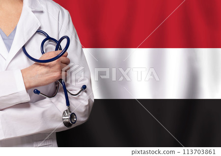 Yemeni medicine and healthcare concept. Doctor close up against flag of Yemen background 113703861