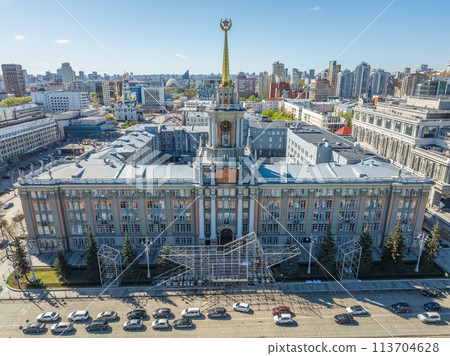 Yekaterinburg City Administration or City Hall and Central square at summer evening. Evening city in the summer sunset, Aerial View. Yekaterinburg City Administration or City Hall and Central square at summer evening. Evening city in the summer sunset, Aerial View. 113704628