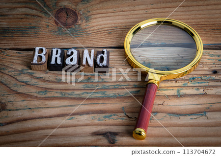 BRAND. Alphabet letters on wood texture background BRAND. Alphabet letters on wood texture background 113704672