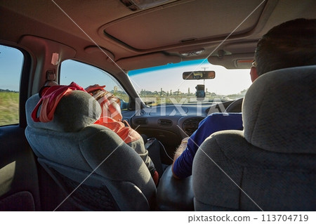 Driving on a road trip 113704719