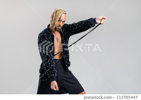 Gay man wearing skirt dancing Gay man wearing skirt dancing 113705447