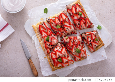 Strawberry and chocolate hazelnut tart on puff pastry 113705737