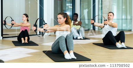 People exercising with pilates ring at class People exercising with pilates ring at class 113708502
