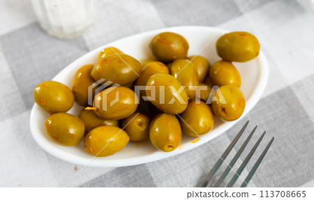 Portion of whole marinated olives Portion of whole marinated olives 113708665