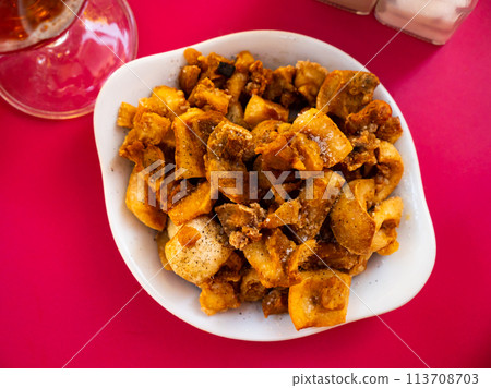 Morros fritos - traditional Spanish meat appetizer served on plate 113708703