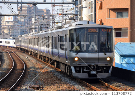 8-car 223 series Kishu-ji rapid train running on the Osaka Loop Line 113708772