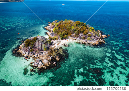 Aerial view of island and clear water Aerial view of island and clear water 113709288