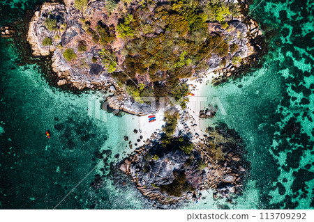Aerial view of island and clear water Aerial view of island and clear water 113709292
