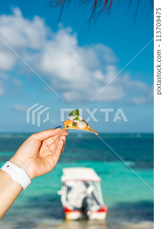 Eating a snack in paradise Eating a snack in paradise 113709475