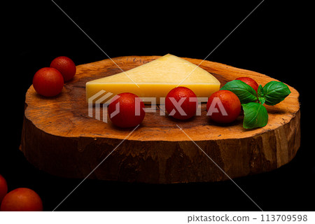 Composition of vegetables and cheese over a wooden plate Composition of vegetables and cheese over a wooden plate 113709598