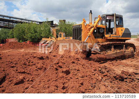 Heavy Power Bulldozer work on a building site 113710589