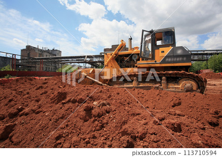 Heavy Power Bulldozer work on a building site Heavy Power Bulldozer work on a building site 113710594