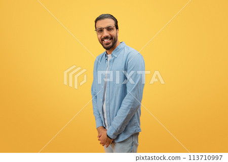 Side view of a smiling man looking at camera Side view of a smiling man looking at camera 113710997