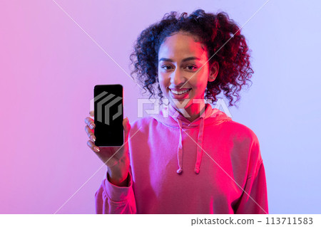 Woman showing smartphone to the camera Woman showing smartphone to the camera 113711583