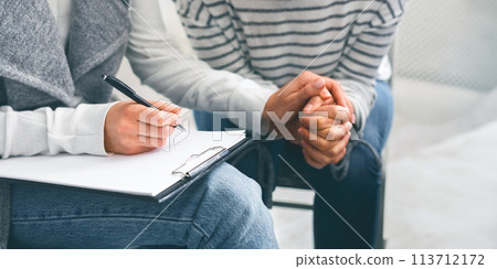 Unrecognizable Female Psychologist Comforting Depressed Woman Patient, Holding Her Hand 113712172