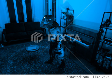 Burglar with flashlight in dark room, break in 113712326