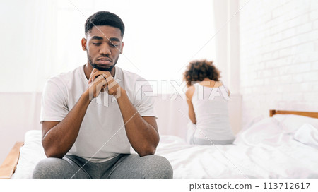 Young couple in bed having problems and crisis Young couple in bed having problems and crisis 113712617