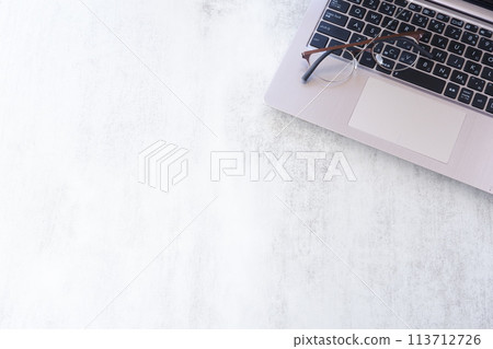 Image of desk work on a laptop Image of desk work on a laptop 113712726