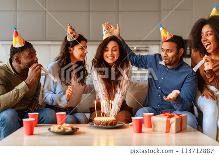 Birthday celebration with cake and friends at home 113712887