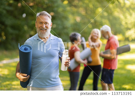 Happy Sporty Senior Man Posing Outdoors While Training With Group Of Friends 113713191