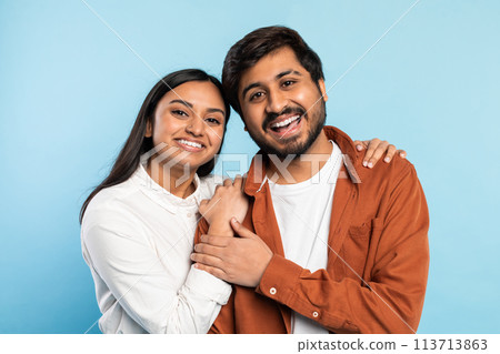 Close-up of a happy couple hugging and smiling 113713863