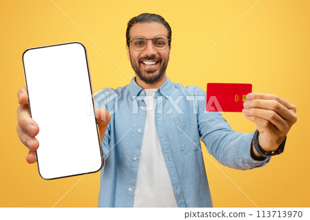 Man with smartphone and credit card 113713970
