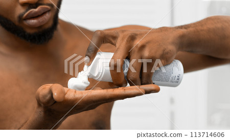Applying shaving foam on hand close-up in bathroom Applying shaving foam on hand close-up in bathroom 113714606
