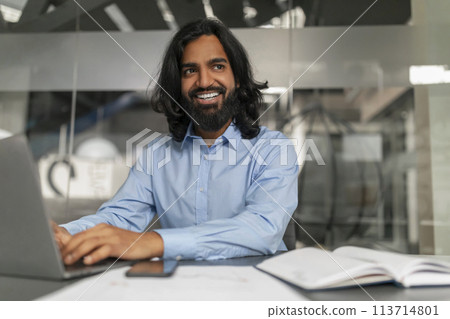 Smiling professional at computer Smiling professional at computer 113714801
