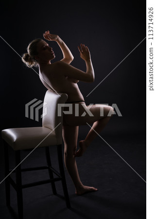 Seductive attractive blonde woman posing in fashionable lingerie in studio Seductive attractive blonde woman posing in fashionable lingerie in studio 113714926