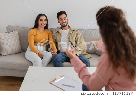 Couple participates in a family therapy session Couple participates in a family therapy session 113715187