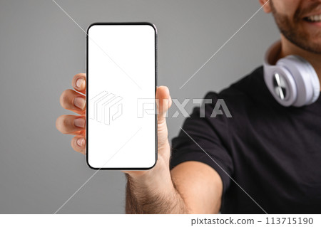 Man holding smartphone with blank screen, cropped Man holding smartphone with blank screen, cropped 113715190