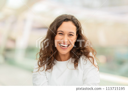 Radiant Beautiful Woman Laughing At Camera While Standing At Airport 113715195