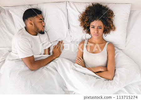 Young couple in bed having problems and crisis 113715274