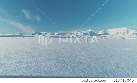 Infinitely, Infinitely polar snowy desert in Antarctica. South Pole frost surface. Scientific base. Snow covered mountains on horizon. Aerial view flight. Ice Landscape. Winter frozen ground drone fly Infinitely, Infinitely polar snowy desert in Antarctica. South Pole frost surface. Scientific base. Snow covered mountains on horizon. Aerial view flight. Ice Landscape. Winter frozen ground drone fly 113715840
