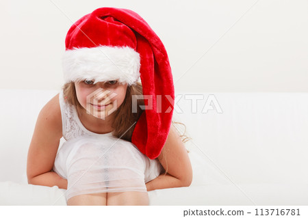 Little girl kid in santa claus hat. Christmas. 113716781