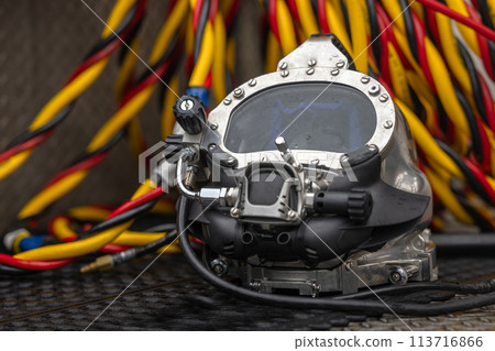 Photo of a commercial dive helmet on the ground 113716866