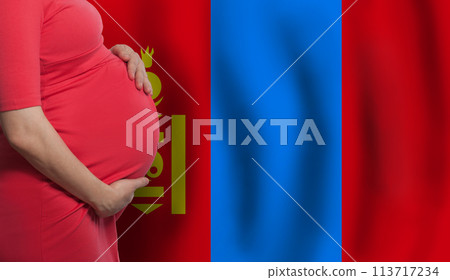 Mongolian pregnant woman belly on flag of Mongolia background Mongolian pregnant woman belly on flag of Mongolia background 113717234