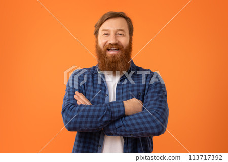 Portrait of funny European redhaired man with beard in glasses 113717392