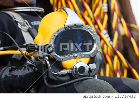 Professional diver ready to enter water Professional diver ready to enter water 113717438