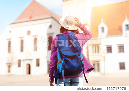 Woman exploring old European city with map 113717976