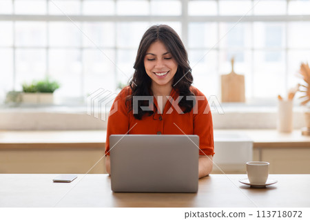 Beautiful middle eastern woman working from home Beautiful middle eastern woman working from home 113718072