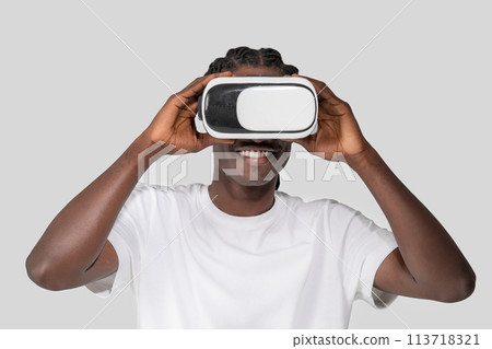 Man exploring virtual reality with a headset Man exploring virtual reality with a headset 113718321